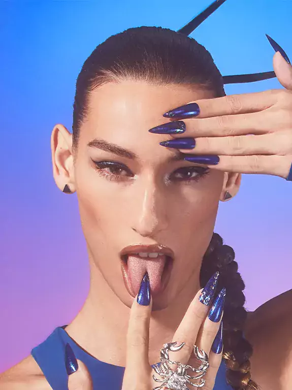 Woman with spiky hair and long dark blue nails