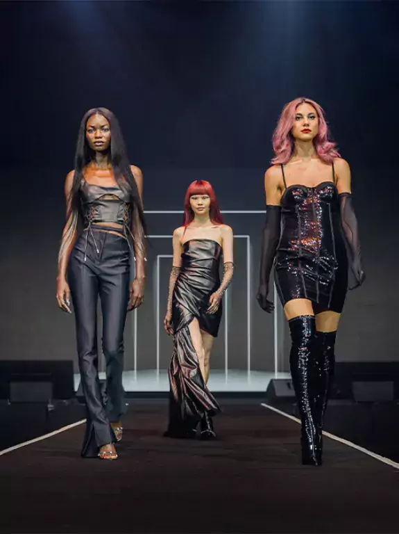 Three models on the catwalk