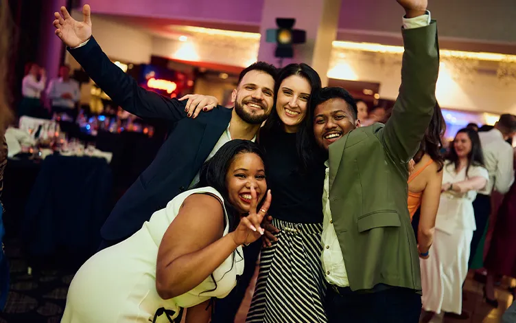 WellaCompany-deib-EmployeesAndCommunities-Card.jpg group of smiling people during an event