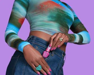 Woman takes an OPI nail polish out of her skirt pocket