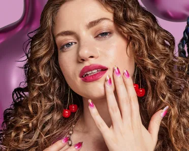Three models showing off different colors of OPI nail polishes